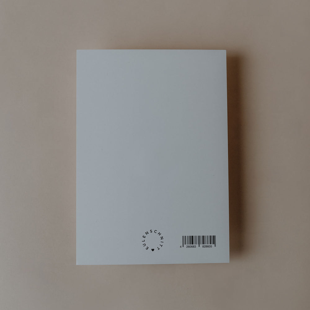 Rückseite einer Postkarte mit Eulenschnitt-Logo und Barcode auf hellem Hintergrund.