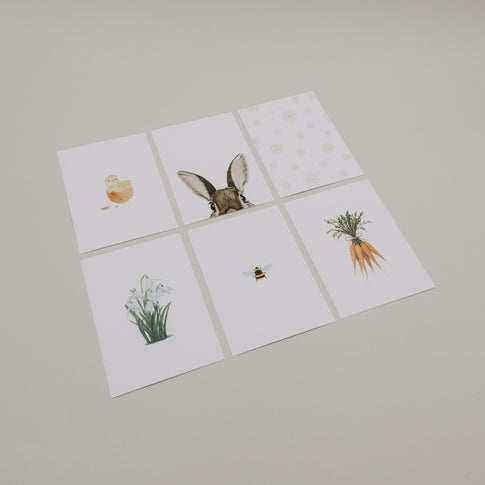 Set aus sechs Aquarellkarten mit Oster-Motiven auf hellem Hintergrund.